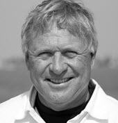 Smiling man outdoors in black and white portrait
