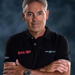 Man wearing SailGP team shirt with folded arms