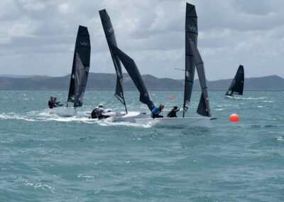 Sailboats racing on choppy sea near New Zealand coast