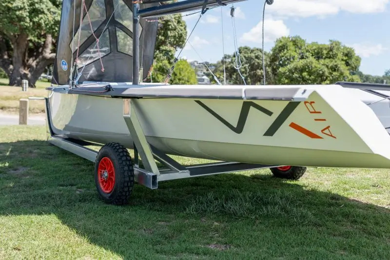 Small sailing boat on trailer at park