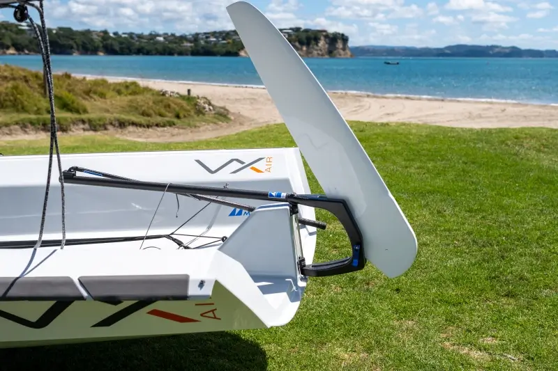 Small sailboat by beach in New Zealand