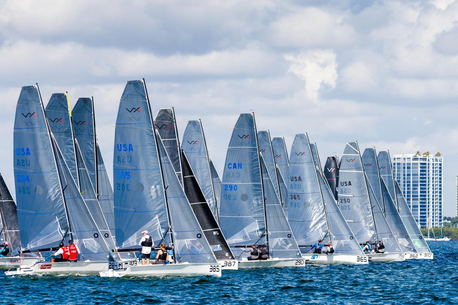 Sailboats racing on a sunny ocean day