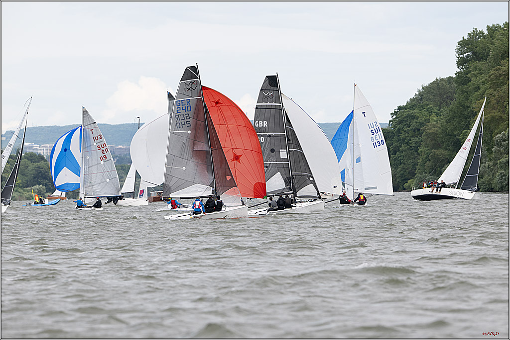 Sailboats racing on a windy lake