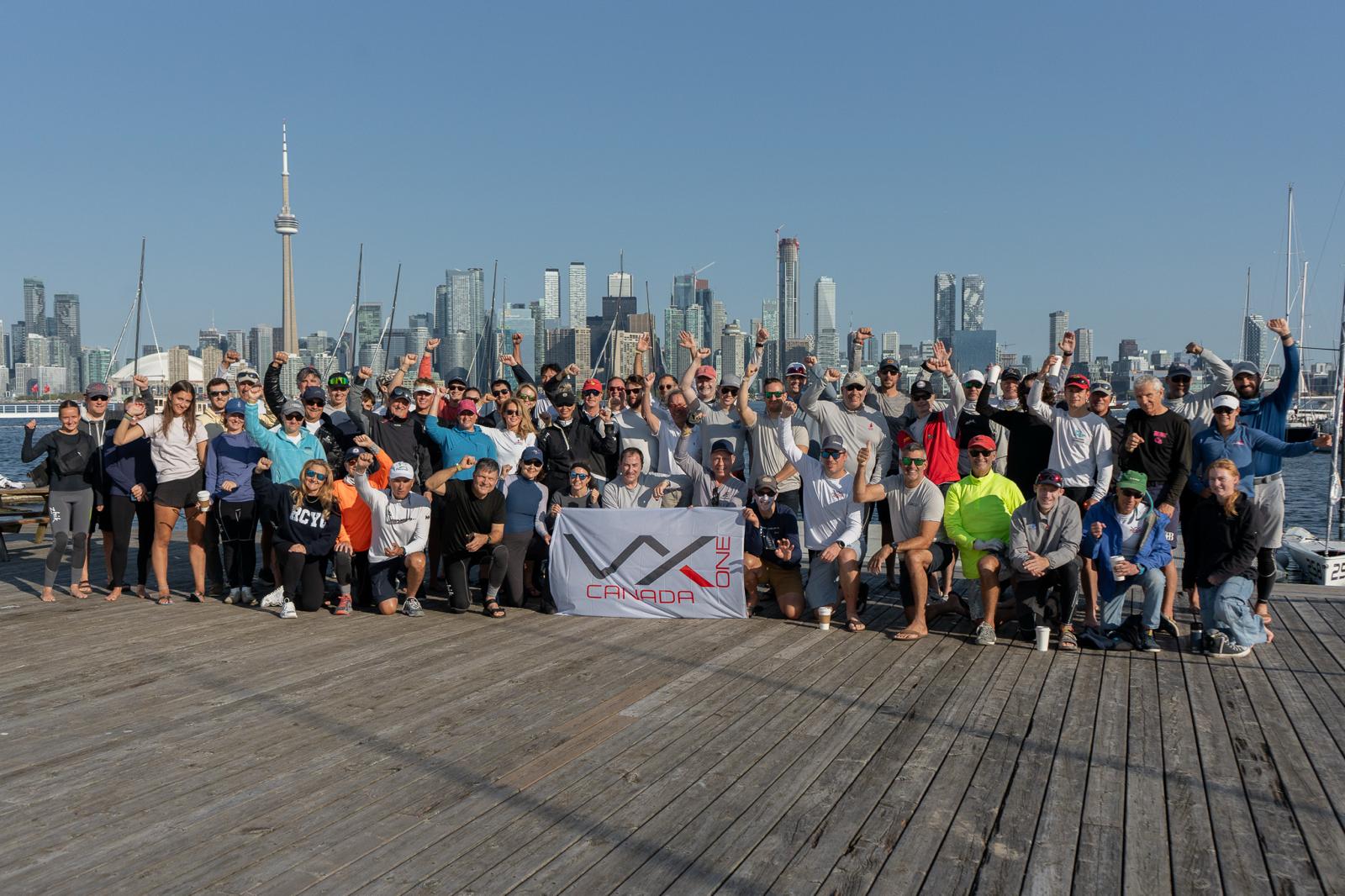Group of sailors posing on harbour dock